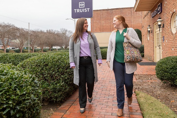 image of Lindsey Chambers with friend outside of Truist building