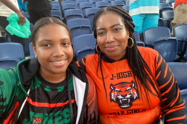 New homeowner and her daughter at a sporting event; they benefitted from affordable housing  created by the nonprofit Lift Orlando and Columbia Residential, with support from Truist and other businesses