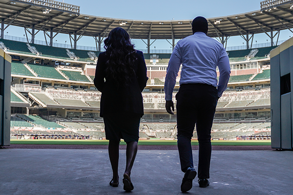 Image of Hall of Zoe and Sterling walking through Stadium