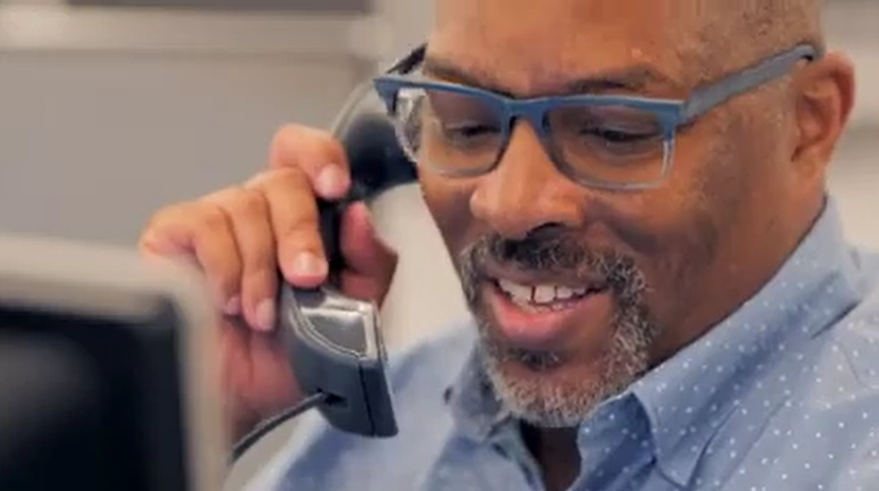 Photo of Paul Bellamy, Truist Client Services Representative, talking on the phone.